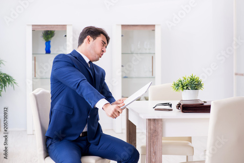 Obraz na płótnie Bankrupt businessman angry and upset at home w salonie