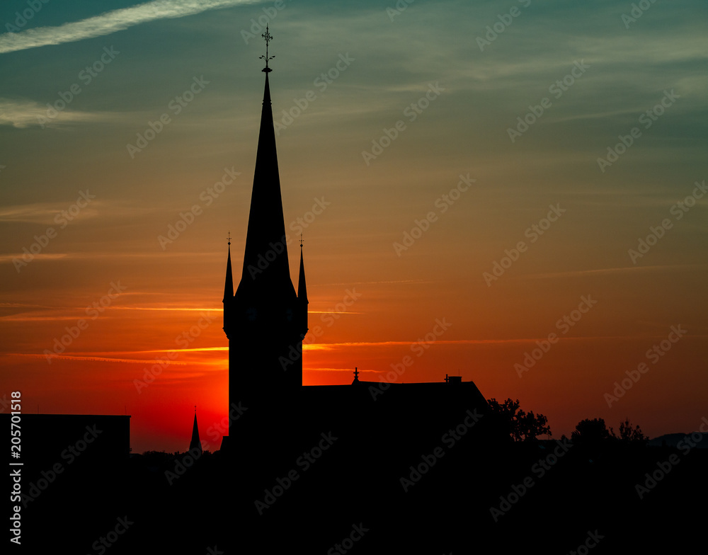 Obraz premium Beautiful Sunset Behind A Church Silhouette And Wonderful Colors
