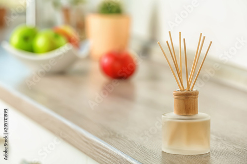 Aromatic reed freshener on table indoors