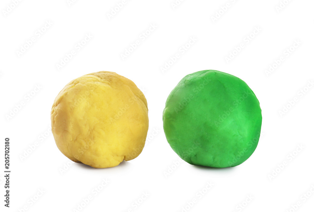 Fototapeta premium Colorful play dough on white background