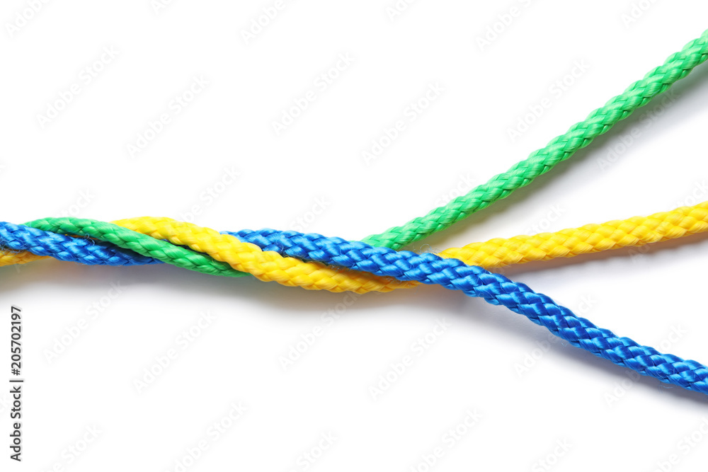 Colorful ropes tied together on white background. Unity concept Colorful ropes tied together on white background. Unity concept