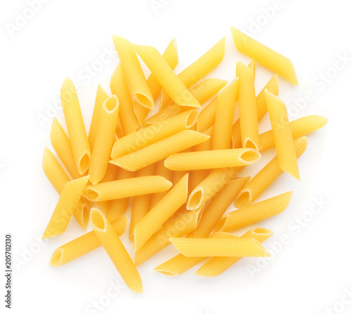 Uncooked penne pasta on white background  top view