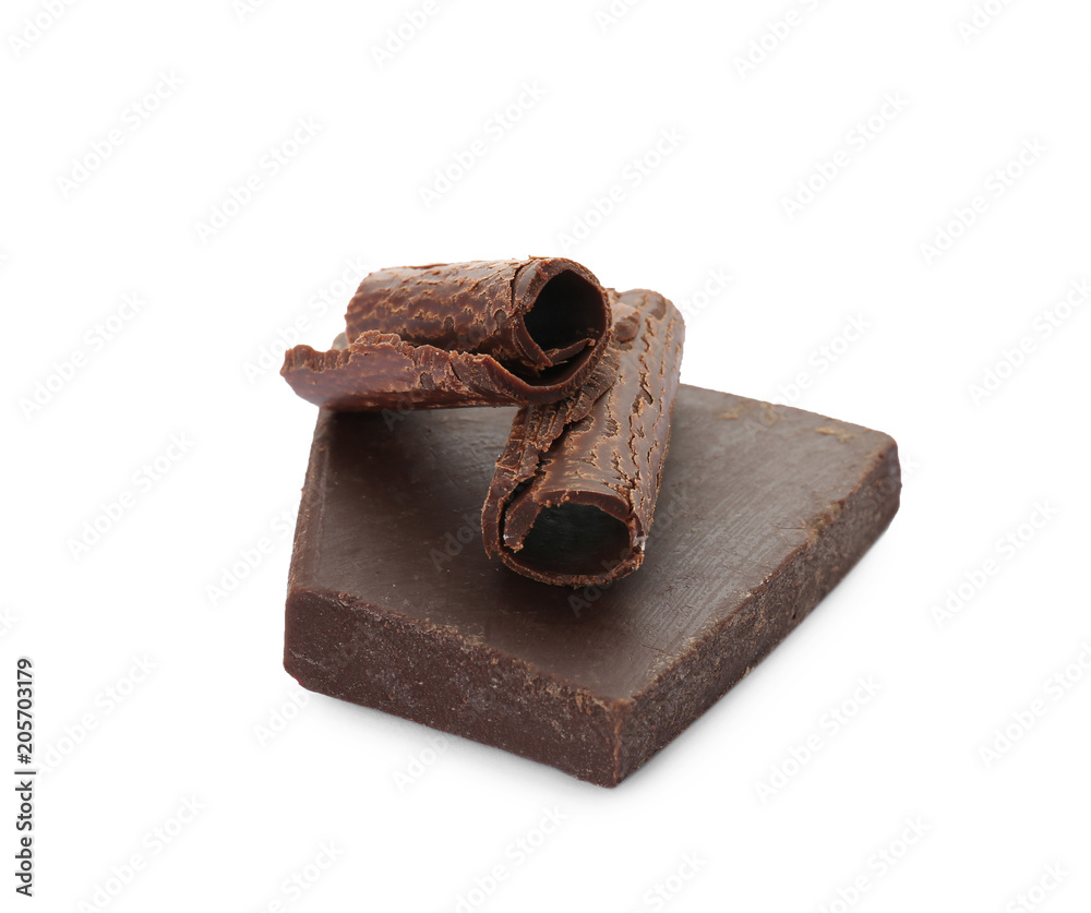 Delicious black chocolate curls and piece on white background Delicious black chocolate curls and piece on white background