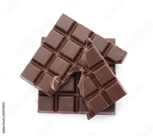 Delicious black chocolate on white background, top view