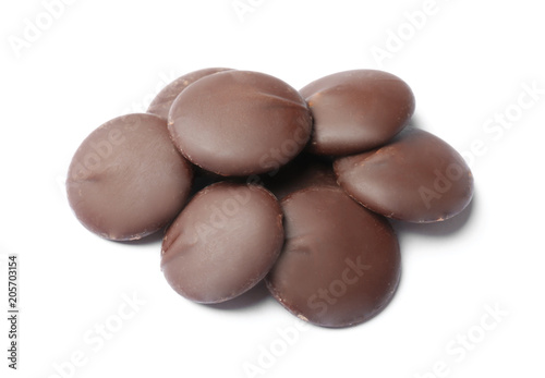 Delicious black chocolate chips on white background