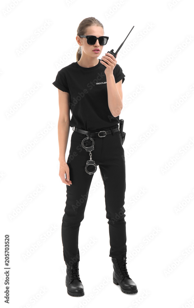 Female security guard using portable radio transmitter on white background Female security guard using portable radio transmitter on white background