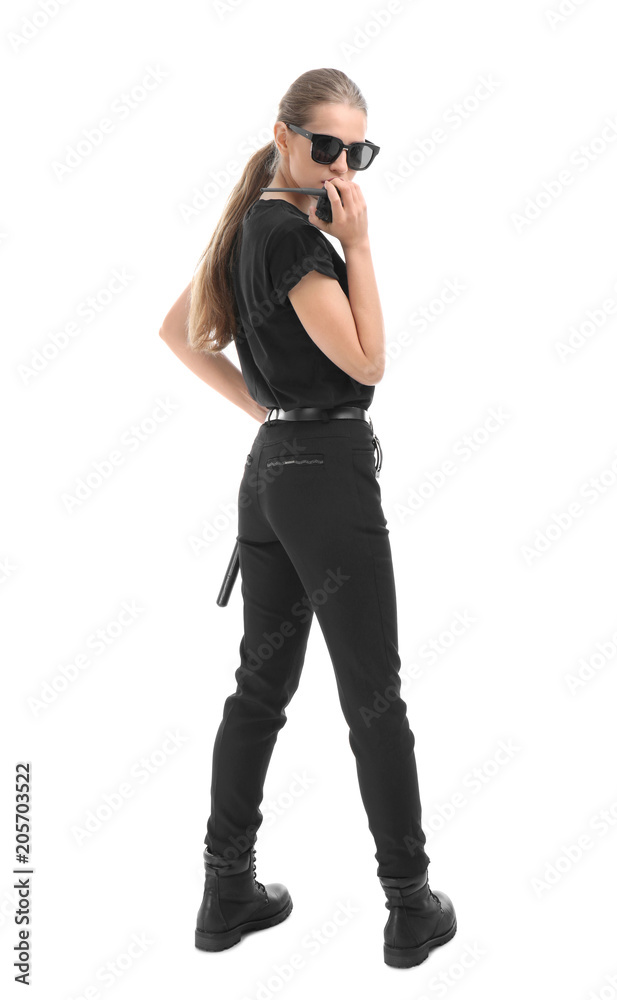Female security guard using portable radio transmitter on white background Female security guard using portable radio transmitter on white background