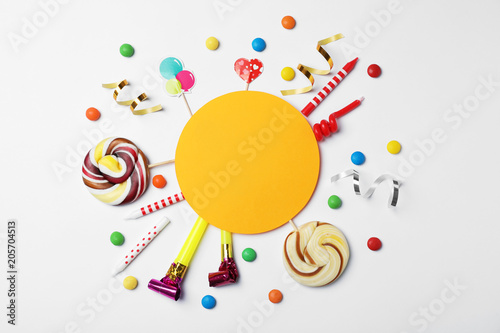 Flat lay composition with birthday party items on light background