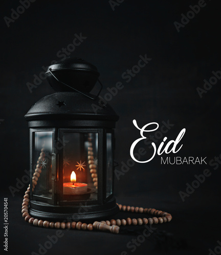 Eid Mubarak Greeting Typography. Ramadan Candle Lantern with Wooden Prayer Beads