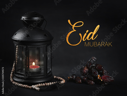 Eid Mubarak Greeting Gold Typography. Ramadan Candle Lantern with Wooden Prayer Beads and Dates