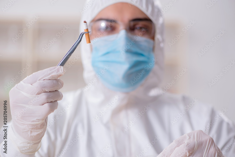 Expert criminologist working in the lab for evidence Expert criminologist working in the lab for evidence