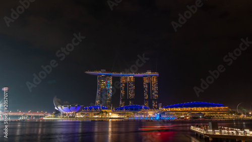 SINGAPORE, DECEMBER 22 2017 : Cityscape of Singapore skyline at twilight time. Marina Bay is a bay located in the Central Area of Singapore.