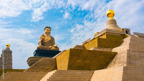 Grand bronze Buddha sitting statue at Fo Guang Shan in Kaohsiung Taiwan photo