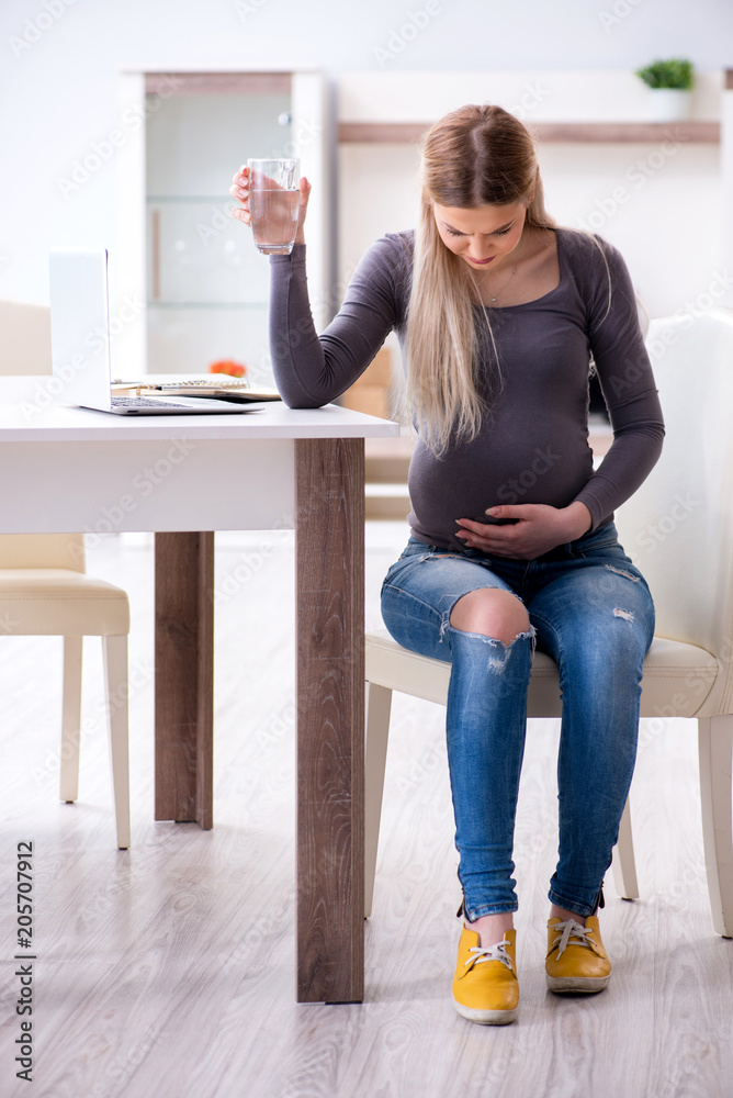 Pregnant woman at home getting ready for childbirth Pregnant woman at home getting ready for childbirth
