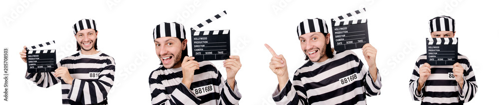 Funny prison inmate with movie board isolated on white Funny prison inmate with movie board isolated on white
