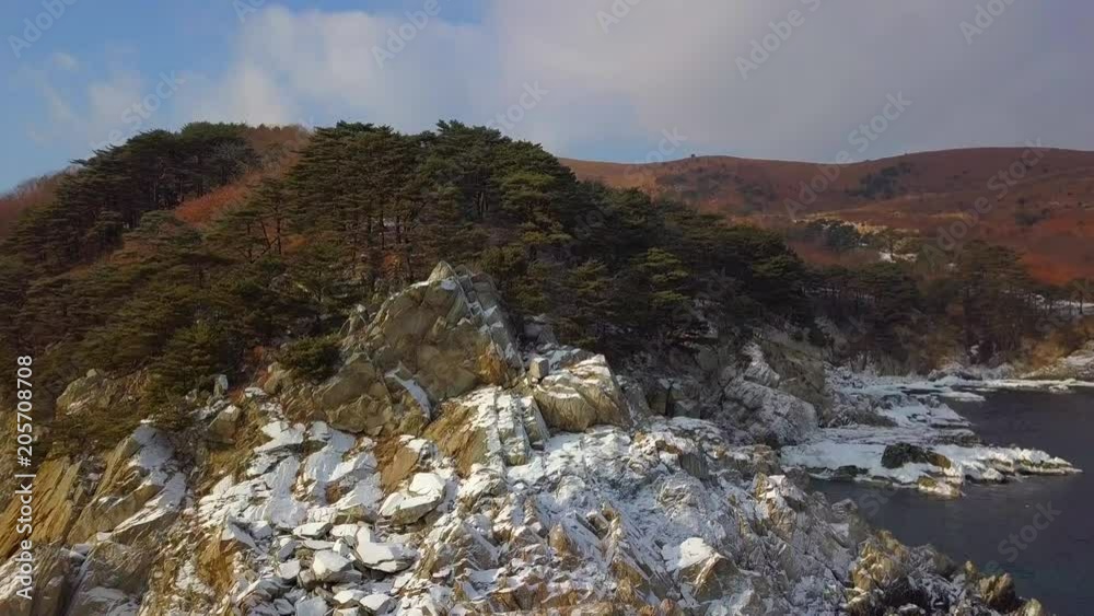 Aerial view of Ocean cliff, steep rocky coastline, Far Eastern Marine Reserve in Primorsky Krai Aerial view of Ocean cliff, steep rocky coastline, Far Eastern Marine Reserve in Primorsky Krai