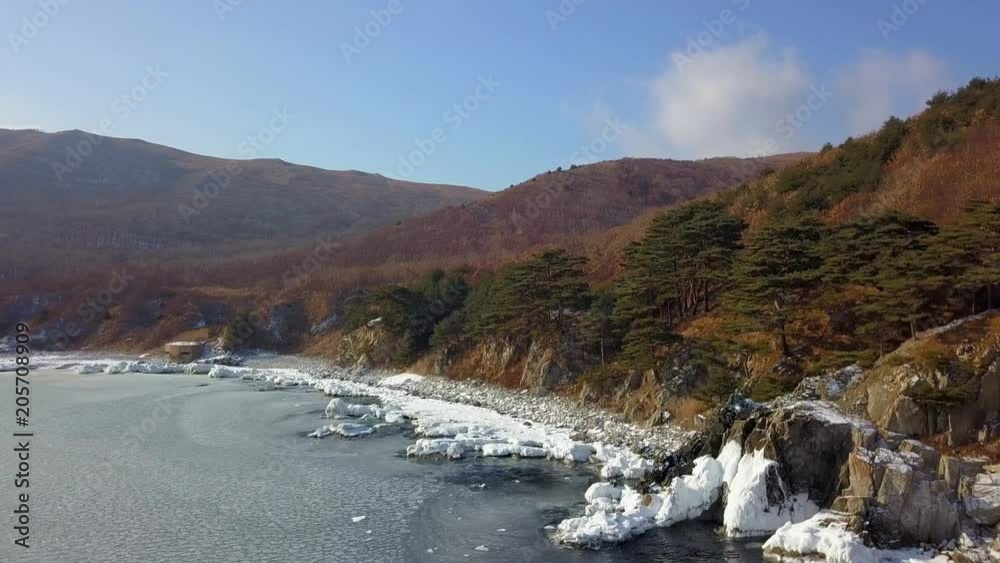 Aerial view of Ocean cliff, steep rocky coastline, Far Eastern Marine Reserve in Primorsky Krai Aerial view of Ocean cliff, steep rocky coastline, Far Eastern Marine Reserve in Primorsky Krai