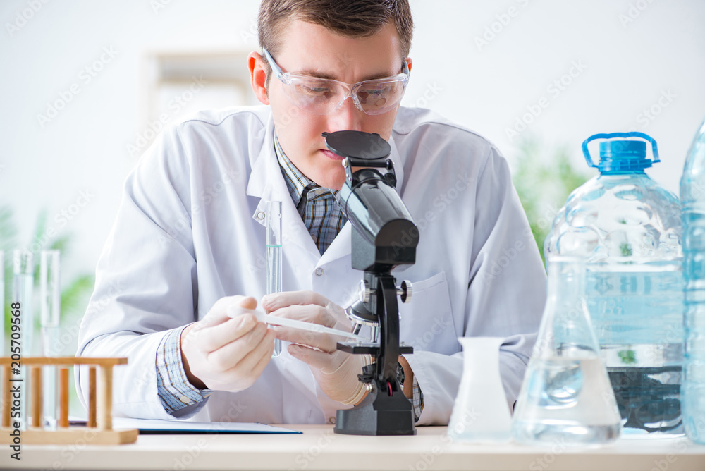 Young chemist student experimenting in lab Young chemist student experimenting in lab