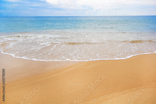 Soft wave of blue ocean on sandy beach. Background. © Thanrada H.