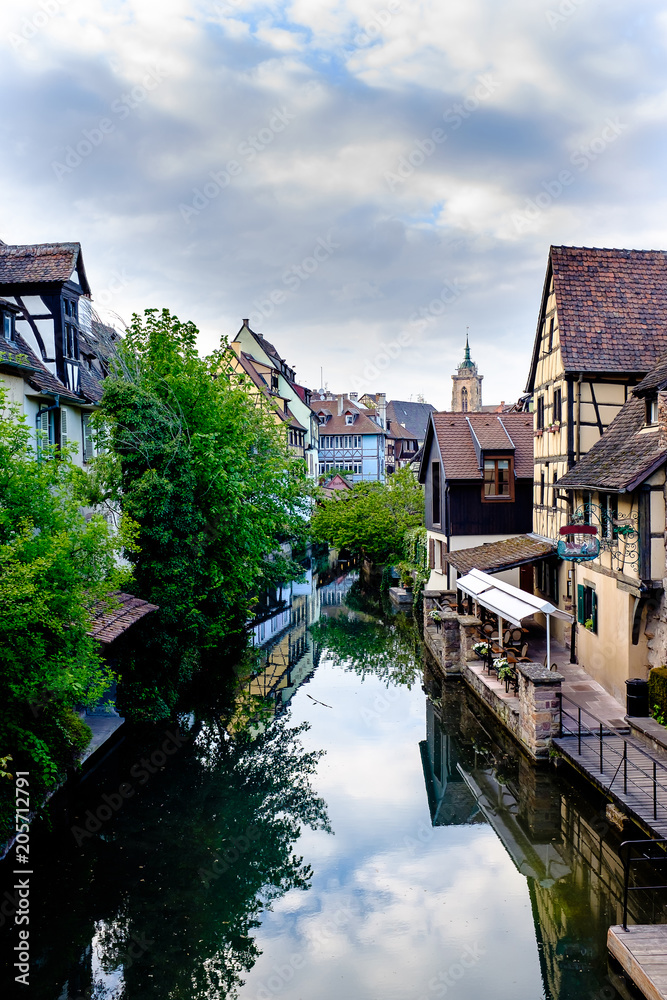 Gorgeous view of little Venice in Colmar, Alsace, with the Colmar Cathedral in the background. Gorgeous view of little Venice in Colmar, Alsace, with the Colmar Cathedral in the background.