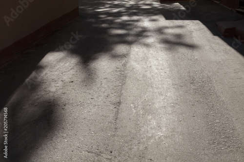 light and shadows on an asphalt street