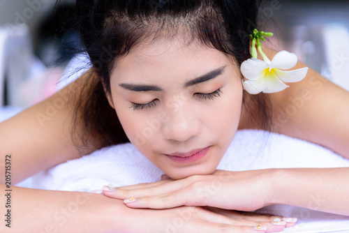 Portrait of beautiful asian people with close up view and close up eyes and having hand massage in spa salon. Beauty  healthy  spa and relaxation concept.