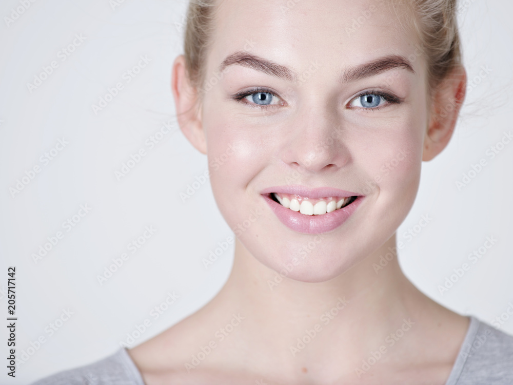 Portrait of a beautiful young smiling girl. Portrait of a beautiful young smiling girl.