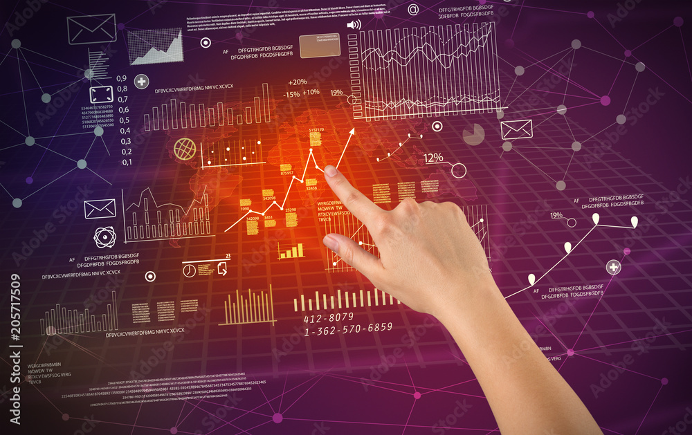 Female hand touching charts and graphs on a red and purple background Female hand touching charts and graphs on a red and purple background