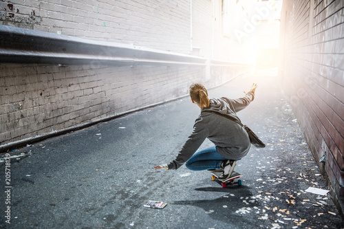 Teenager girl ride her skateboard. Mixed media