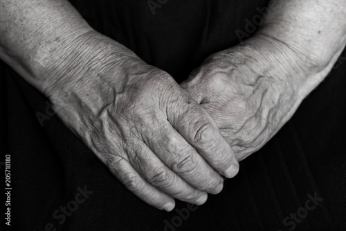 Old woman's hands, grandmother's hands, close-up, concept time, generational change black and white
