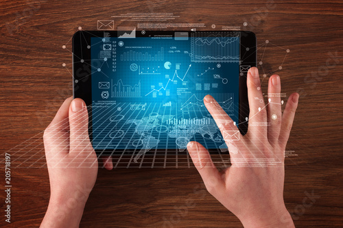 Caucasian business hands holding tablet with business screen 