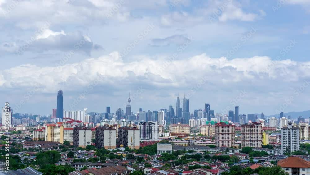 4K Time lapse of moving clouds over downtown Kuala Lumpur, Malaysia. Zoom In. 4K Time lapse of moving clouds over downtown Kuala Lumpur, Malaysia. Zoom In.