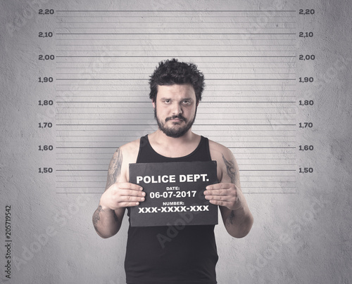 Caught gangster in jail with table on his hand.