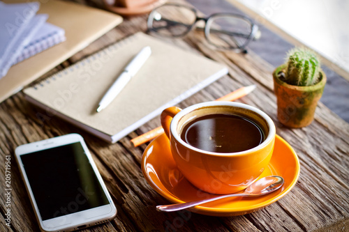 Desk work coffee cup and laptop notebook pen on wooden table