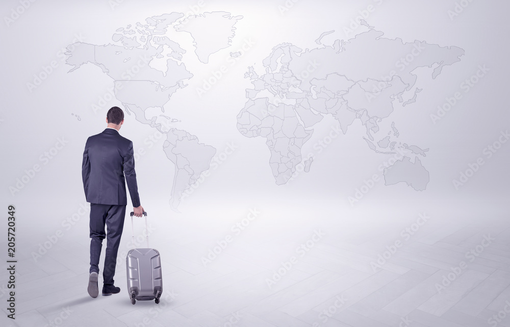 Businessman in dark suit planning his trip in a front of a map
Businessman in dark suit planning his trip in a front of a map