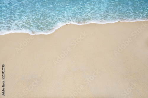 Soft wave and sea bubble of blue sea on sandy beach © Mizkit