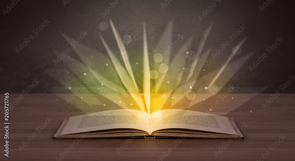 Yellow lights spreading from an open book Yellow lights spreading from an open book