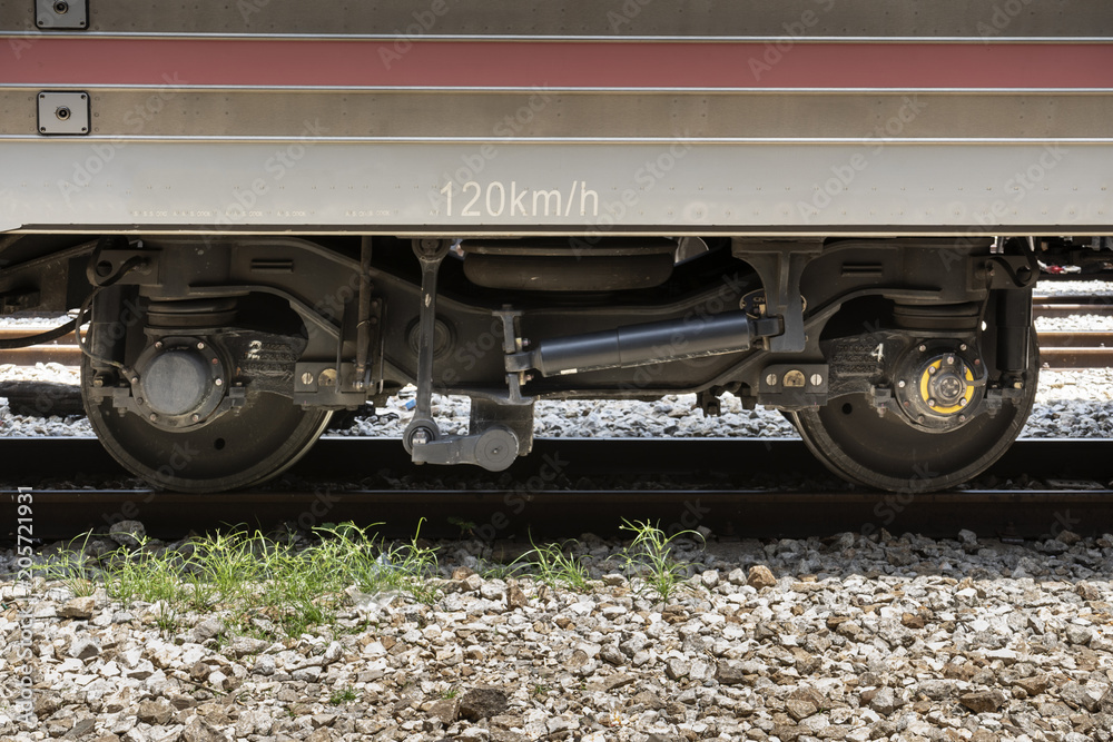 A closeup view of the wheels of a train