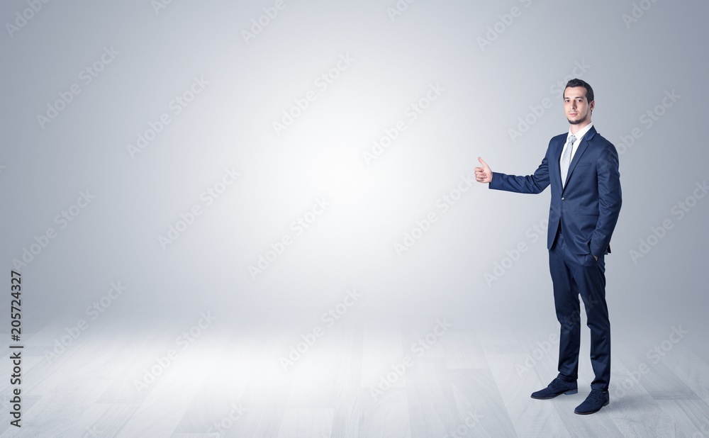 Lonely businessman hitchhikes concept with copy space around him
Lonely businessman hitchhikes concept with copy space around him
