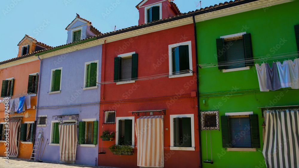 Multicolored street on Burano, famous vivid architecture, tourist attraction