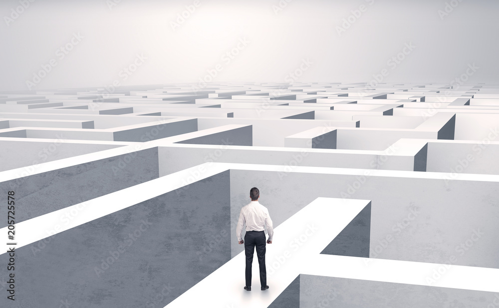 Small businessman in a middle of a huge maze
Small businessman in a middle of a huge maze
