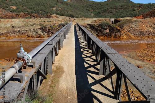 The iron bridge of Cachan was built on the river Odiel in 1875 photo