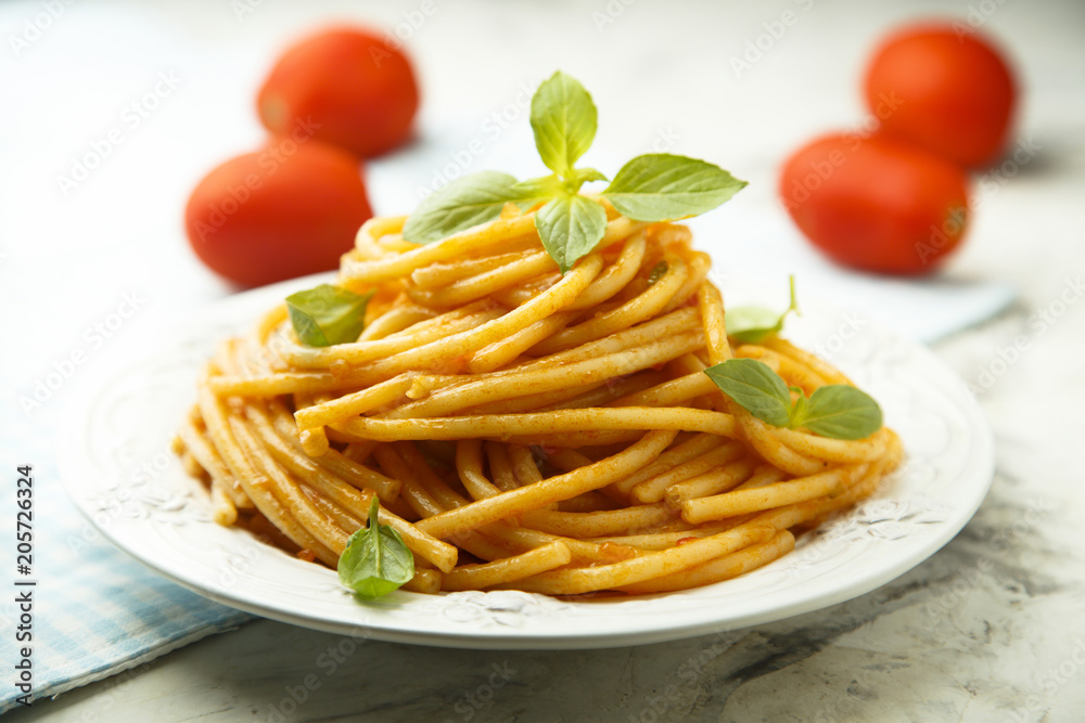 Pasta with tomato sauce and fresh basil Pasta with tomato sauce and fresh basil