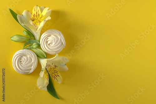 Alstroemeria flowers white zephyr on yellow paper background. photo