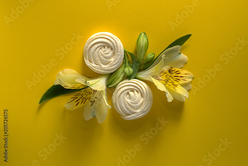 Alstroemeria flowers white zephyr on yellow paper background. photo