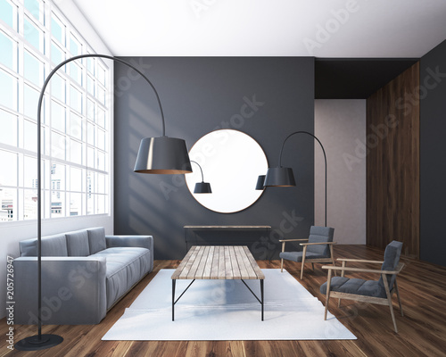 Gray living room with a round mirror