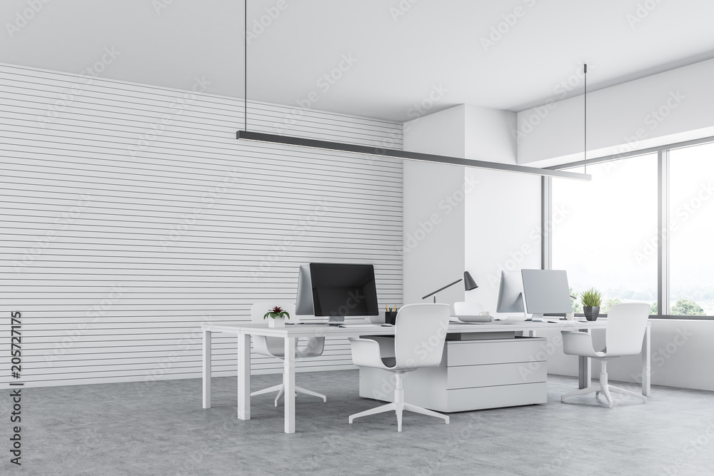 White office interior with computers side view White office interior with computers side view