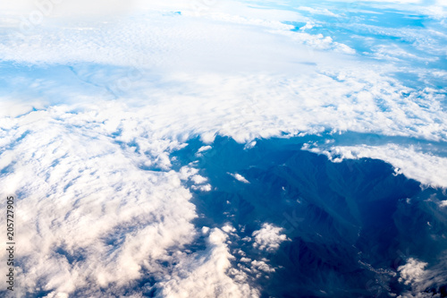 Fototapeta Naklejka Na Ścianę i Meble -  Blue sky and Cloud and mountain top view from airplane window,Nature background
