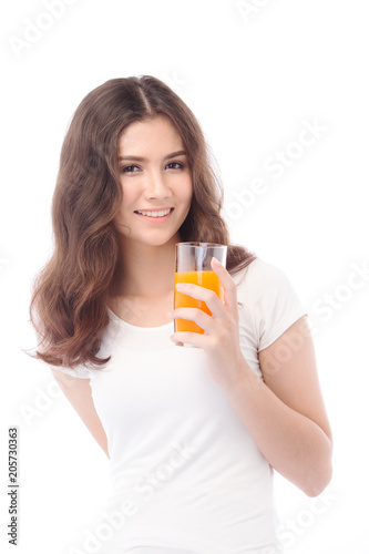 Portrait of a woman drinking orange juice. Orange juice in glass
