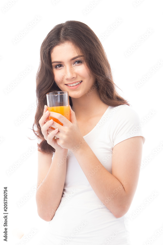Portrait of a woman drinking orange juice. Orange juice in glass Portrait of a woman drinking orange juice. Orange juice in glass